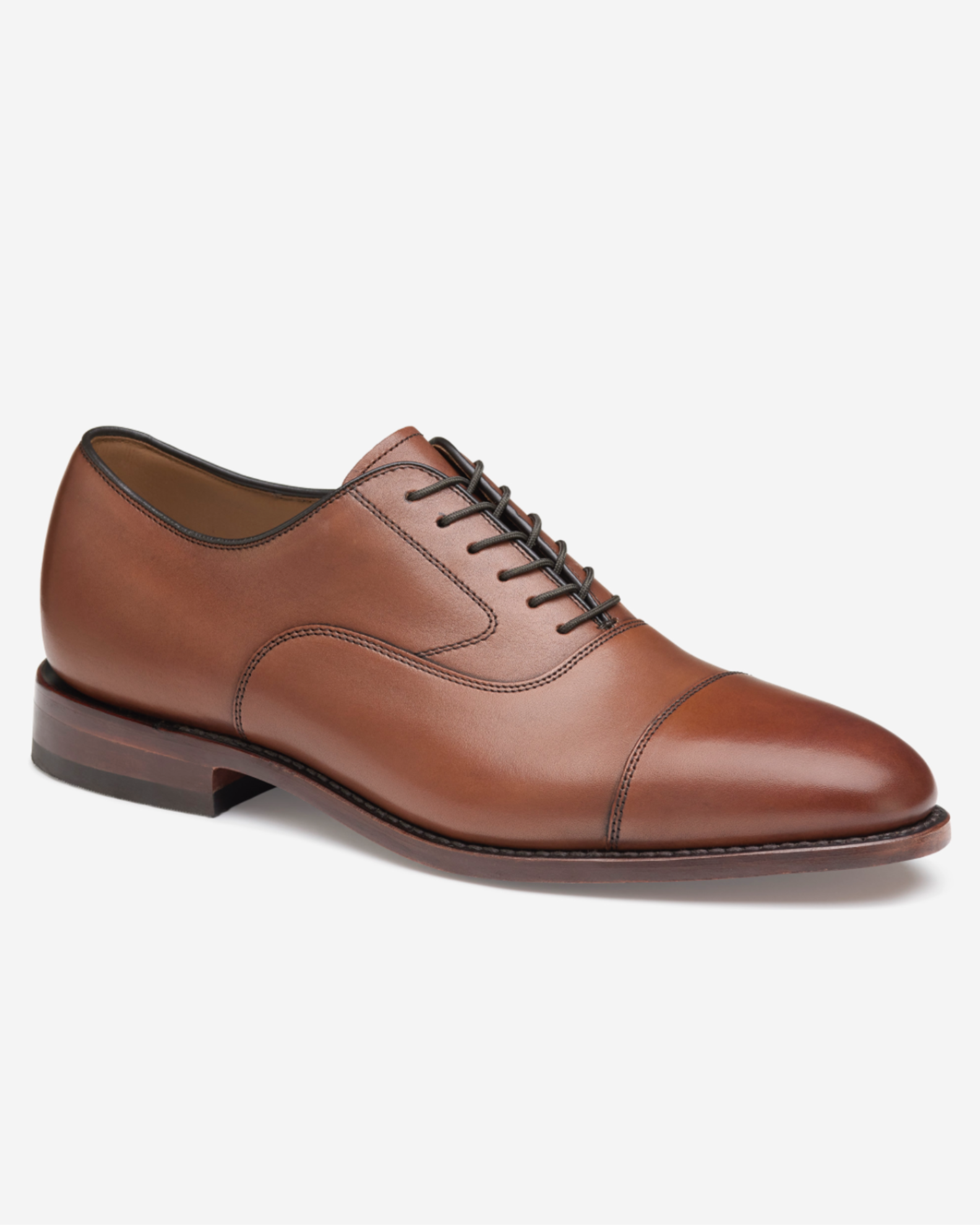 Brown leather dress shoe on a white background